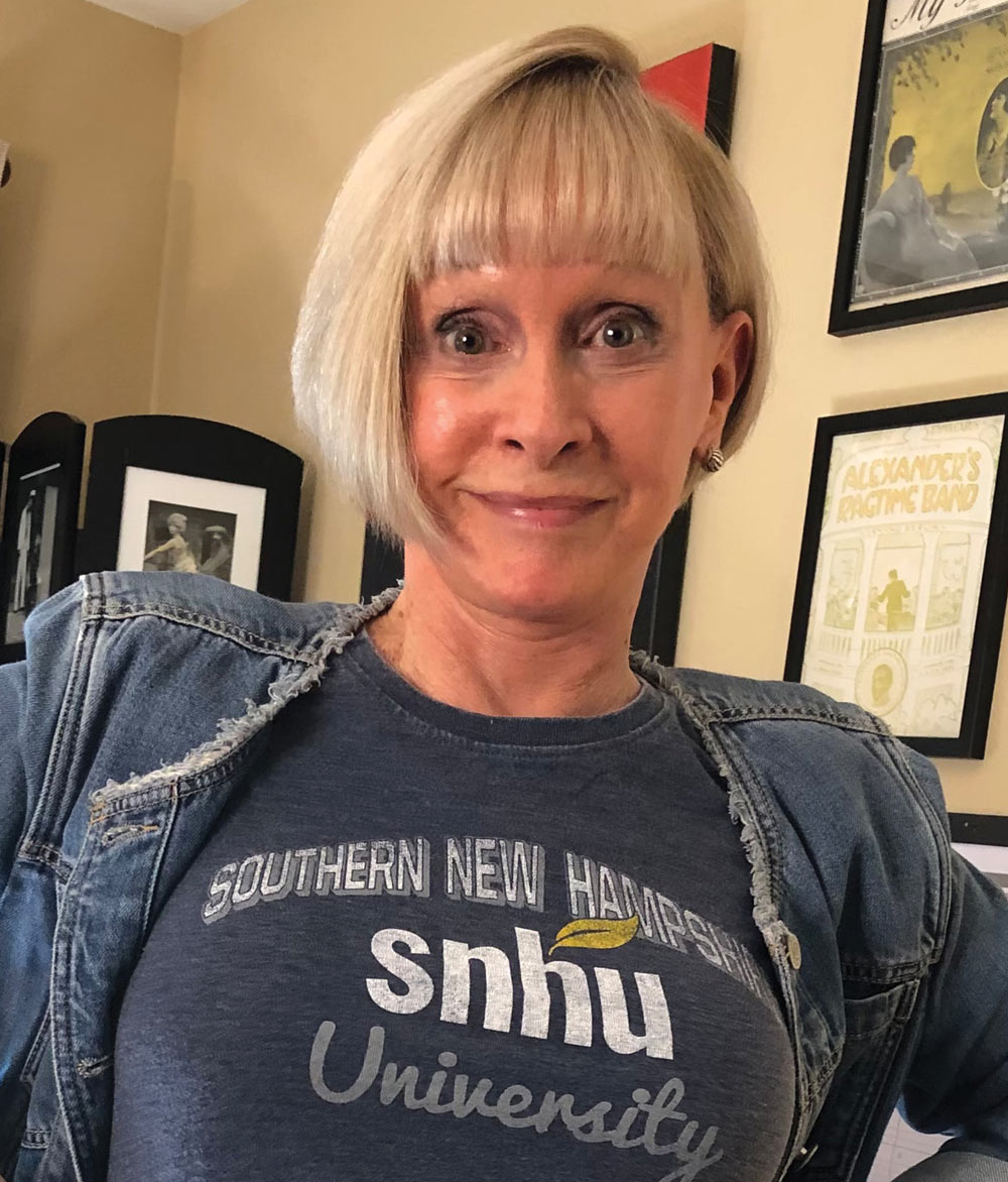 headshot of woman wearing an SNHU shirt