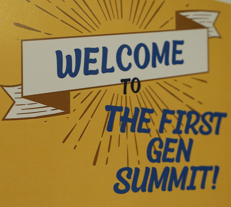 close up of a yellow sign that says "Welcome to The First Gen Summit"